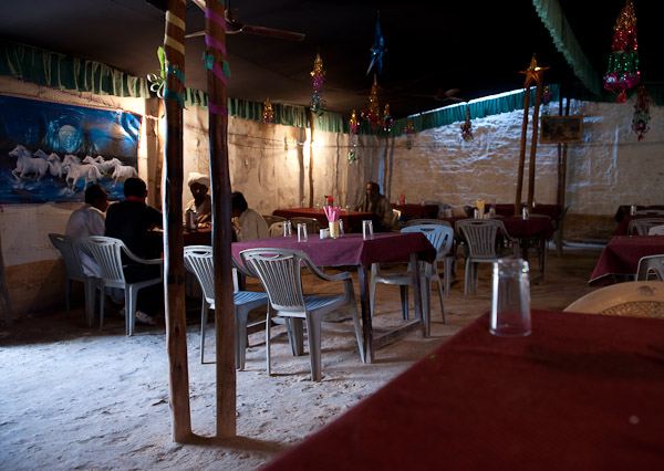 India_JanFeb_10_Jaisalmer_6879.jpg - Interior of Milan Restaurant.  Best chicken in India.  Dirt floor.  Milan means "coming together"