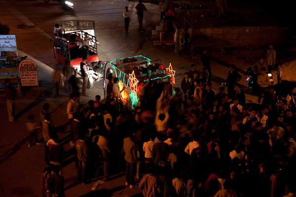 India_JanFeb_10_Jaisalmer_7106.jpg - Wedding party.  They tow a generator to power a sound system.  Somehwere there's a bridegroom on a white horse.  Very traditional.