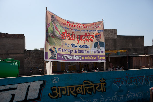 India_JanFeb_10_Jodhpur_6205.jpg - Shooting out the window in a bus between Pushkar and Jodhpur.  Looks like election posters.