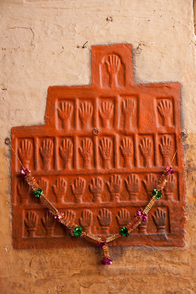 India_JanFeb_10_Jodhpur_6246.jpg - Handprints of women who committed sati in 1843.  They threw themselves on the Marharaja's funeral pyre.  There was a different set of handprints behind me.