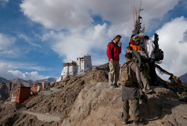 _DSC9737.jpg - Congregation of foreigners at the prayer pole.  The Red and White Temples overlook Leh