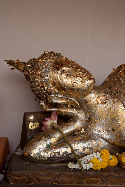 Thailand_Bangkok_OctNovDec_2010_8347.jpg - Reclining Buddha.  They stick gold leaf on the statues.